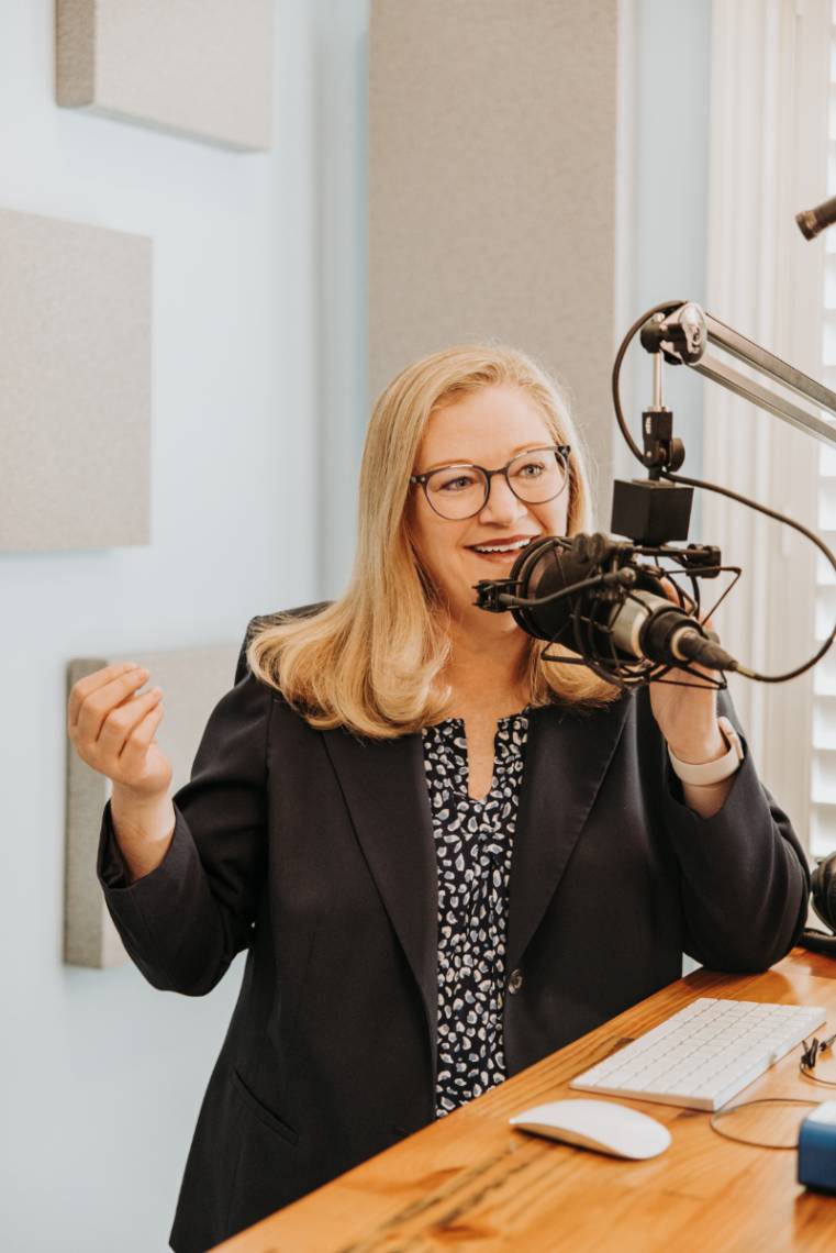 headshot of Bonnie Stachowiak with podcasting microphone