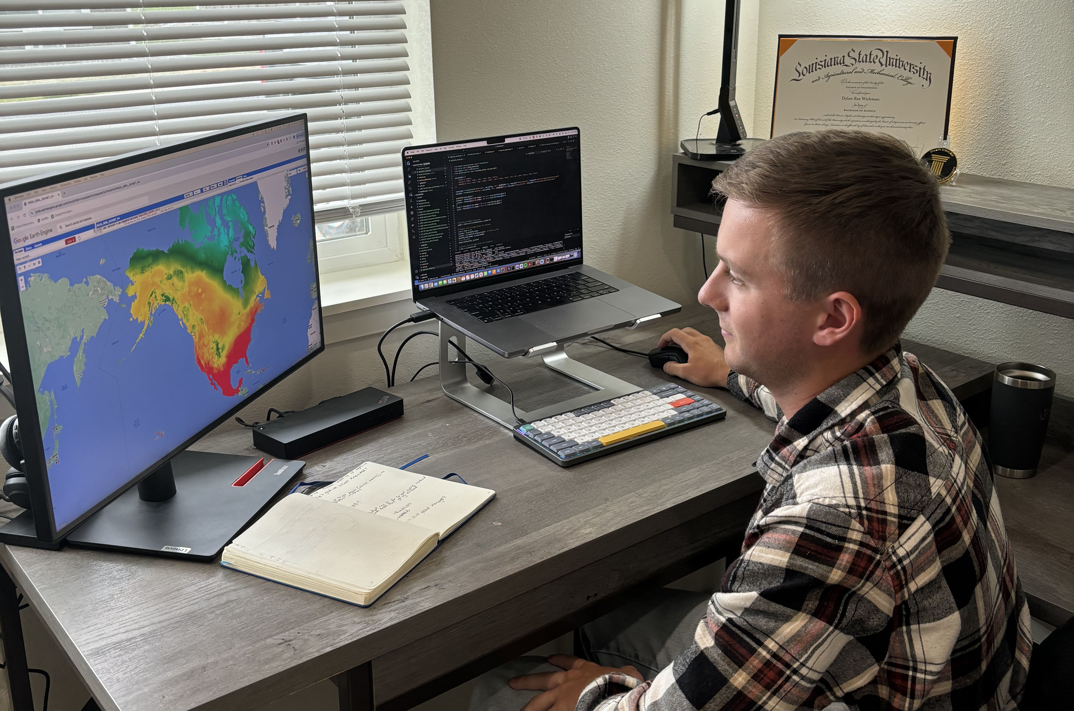 Dylan Wichman working at a computer in his home office.