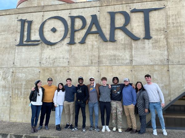 Group of students in front of Llopart winery sign.