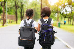 young girls walking home from school