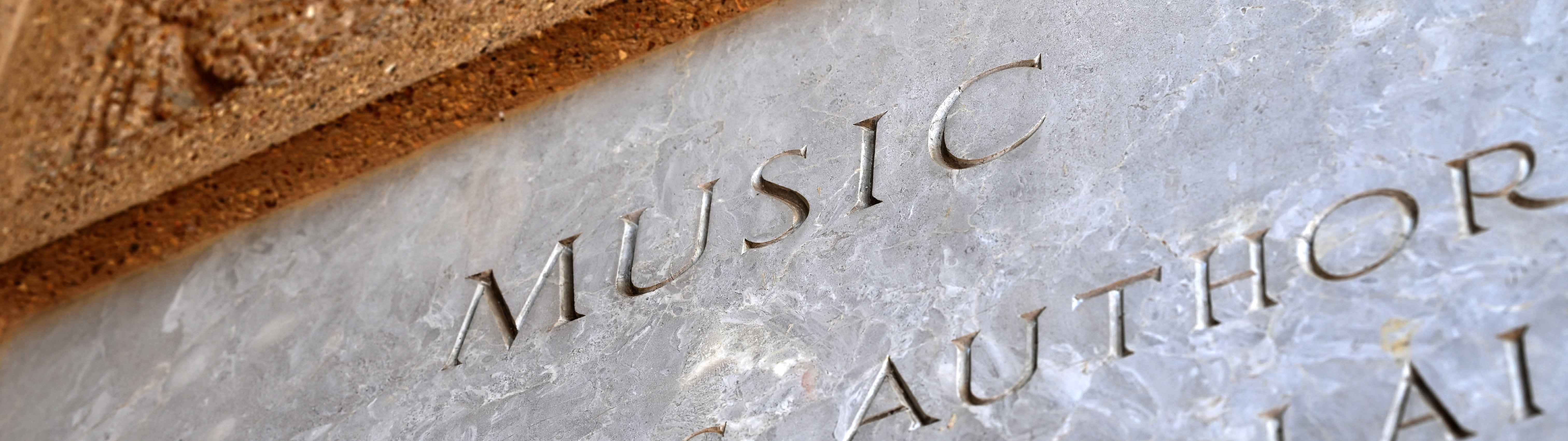 engraving of music on a wall