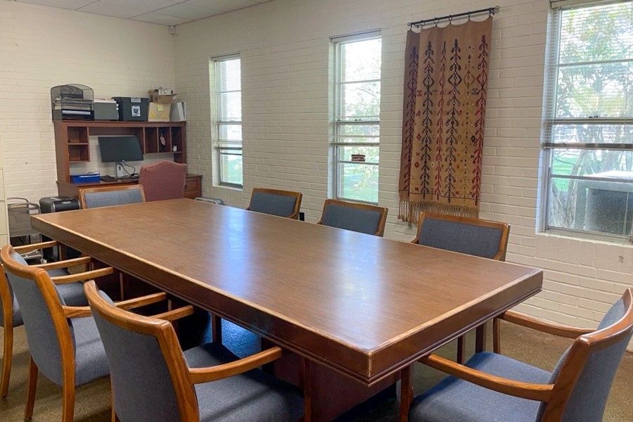 conference room with table and eight chairs
