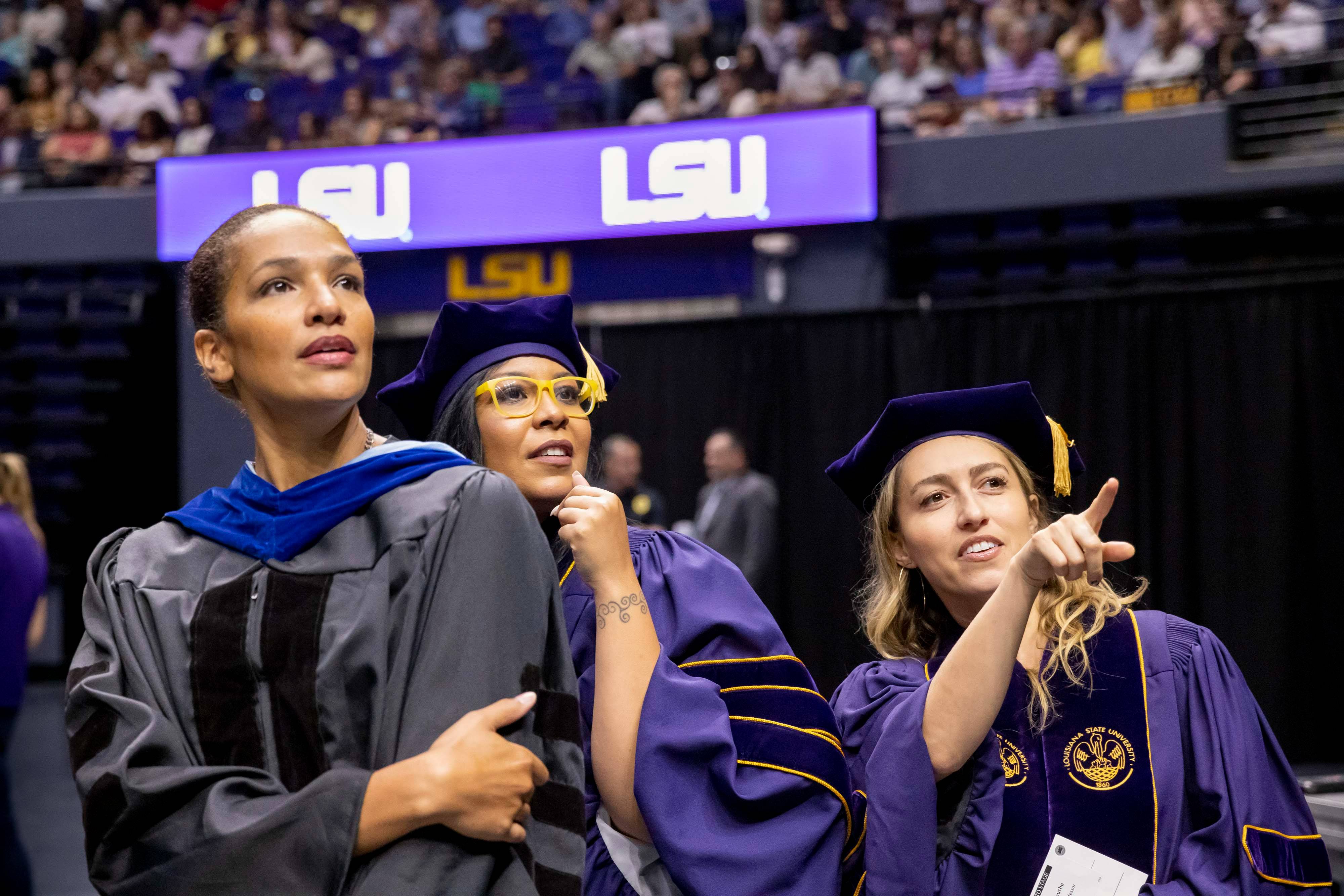 Three diverse women doctoral graduates