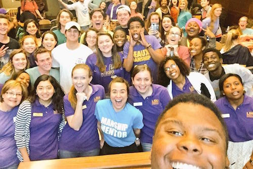 Selfie of students smiling in the Holliday Forum