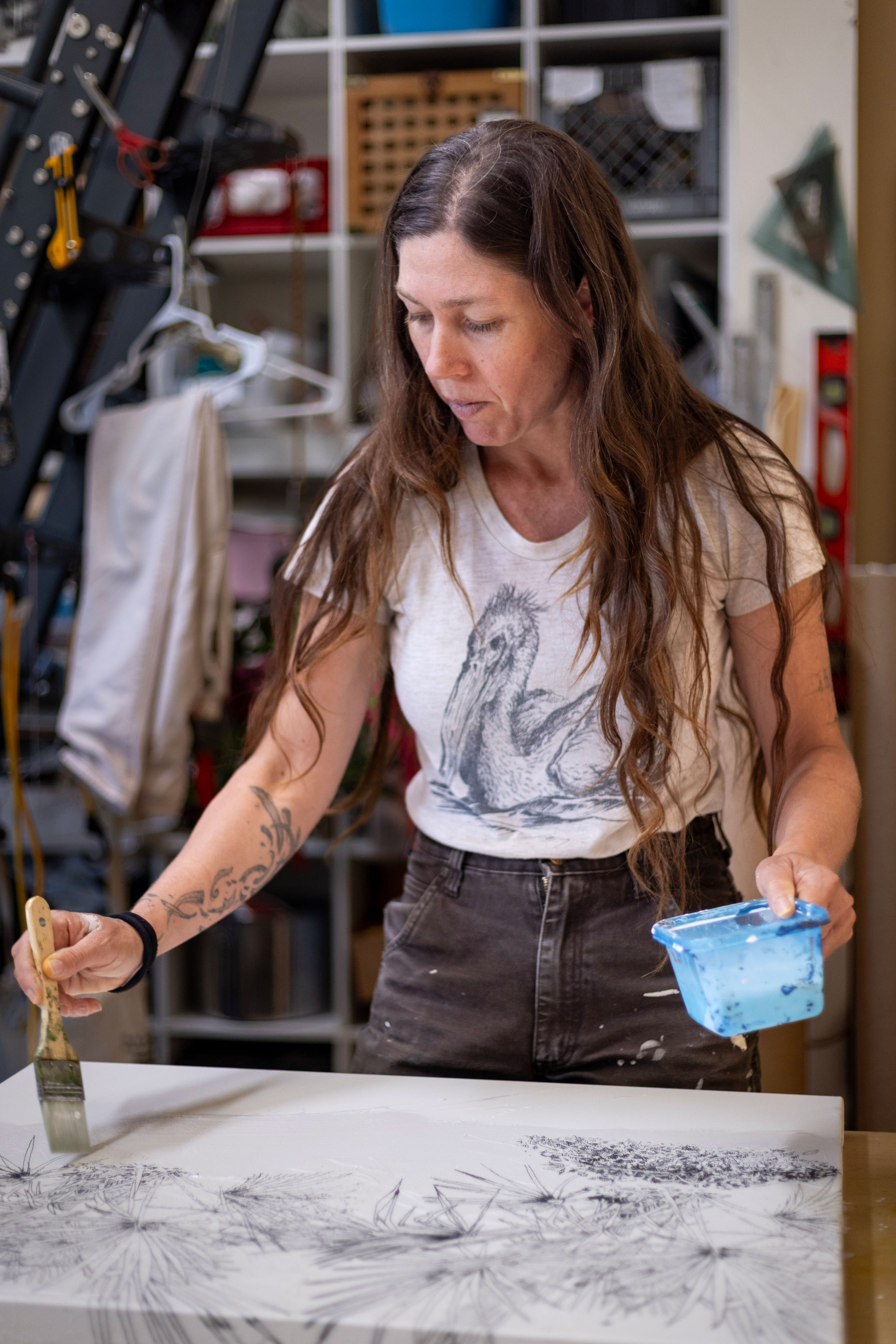 Pippin Frisbie-Calder painting in her studio